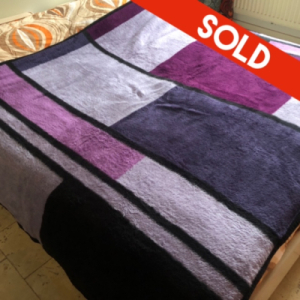 Paars geblokte deken