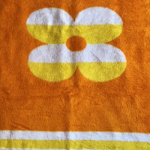 Oranje bloem kinderdekentje 