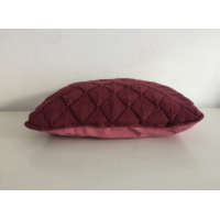 Purple knitted pillow