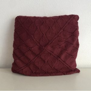 Purple knitted pillow