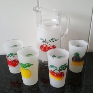 4 juice glasses with pitcher