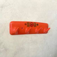 Oranje space age kapstok - Syla