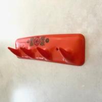 Oranje space age kapstok - Syla