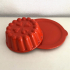 Orange ceramic pudding mold