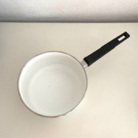 Oranje bloemen steelpannen